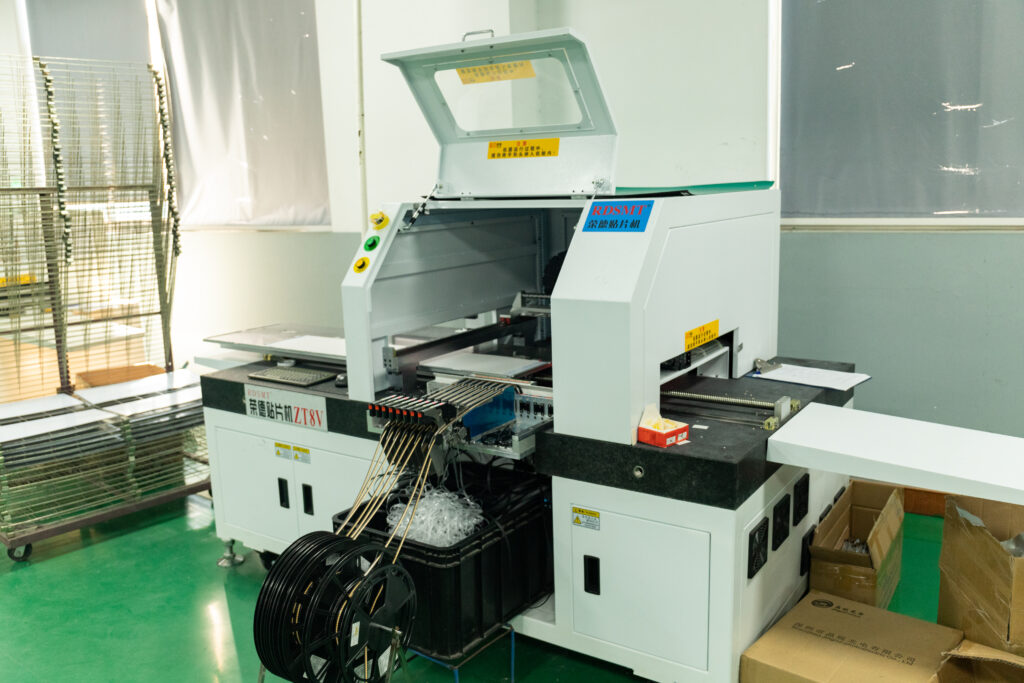 Automated SMT component placement equipment at the New Lights factory