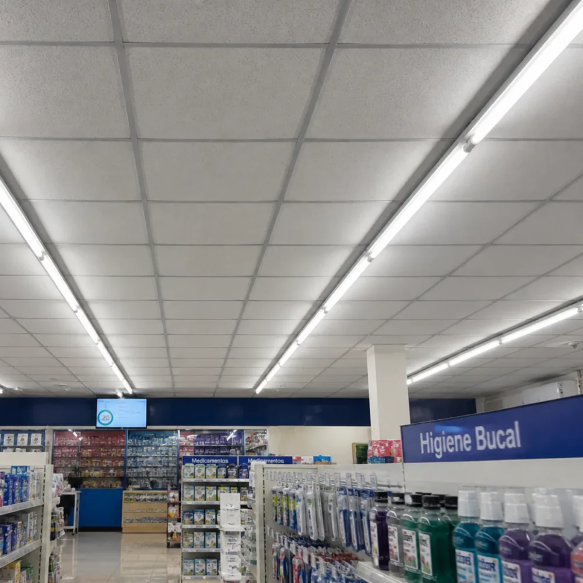 T8 LED glass tubes installed in ceiling fixtures in a Latin American pharmacy