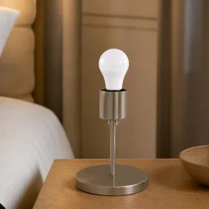 G45 LED golf-ball bulb installed in a compatible hospitality bedside lamp