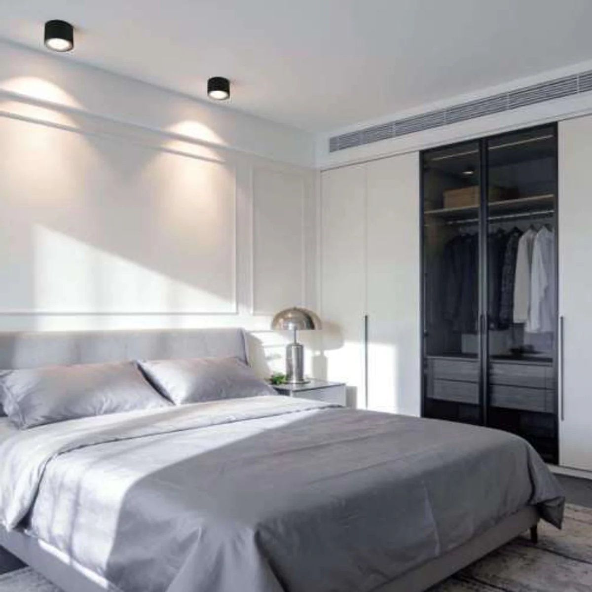 ITFT01M family adjustable surface-mounted LED downlights illuminating a bedroom wall
