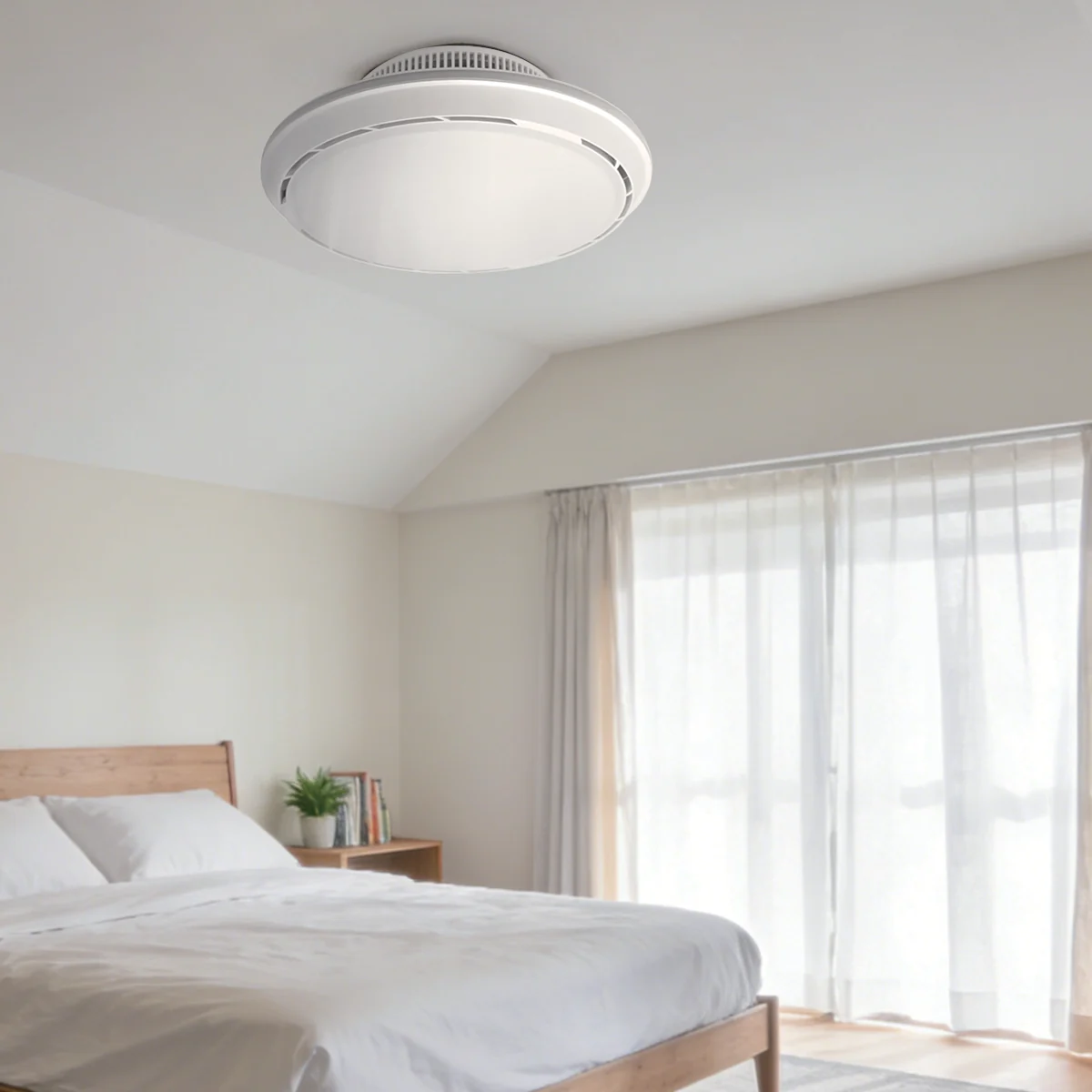 Hidden bladeless ceiling-mount LED fan light installed in a bedroom