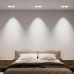 Multi-head GU10 recessed fixture frames installed flush in a bedroom ceiling
