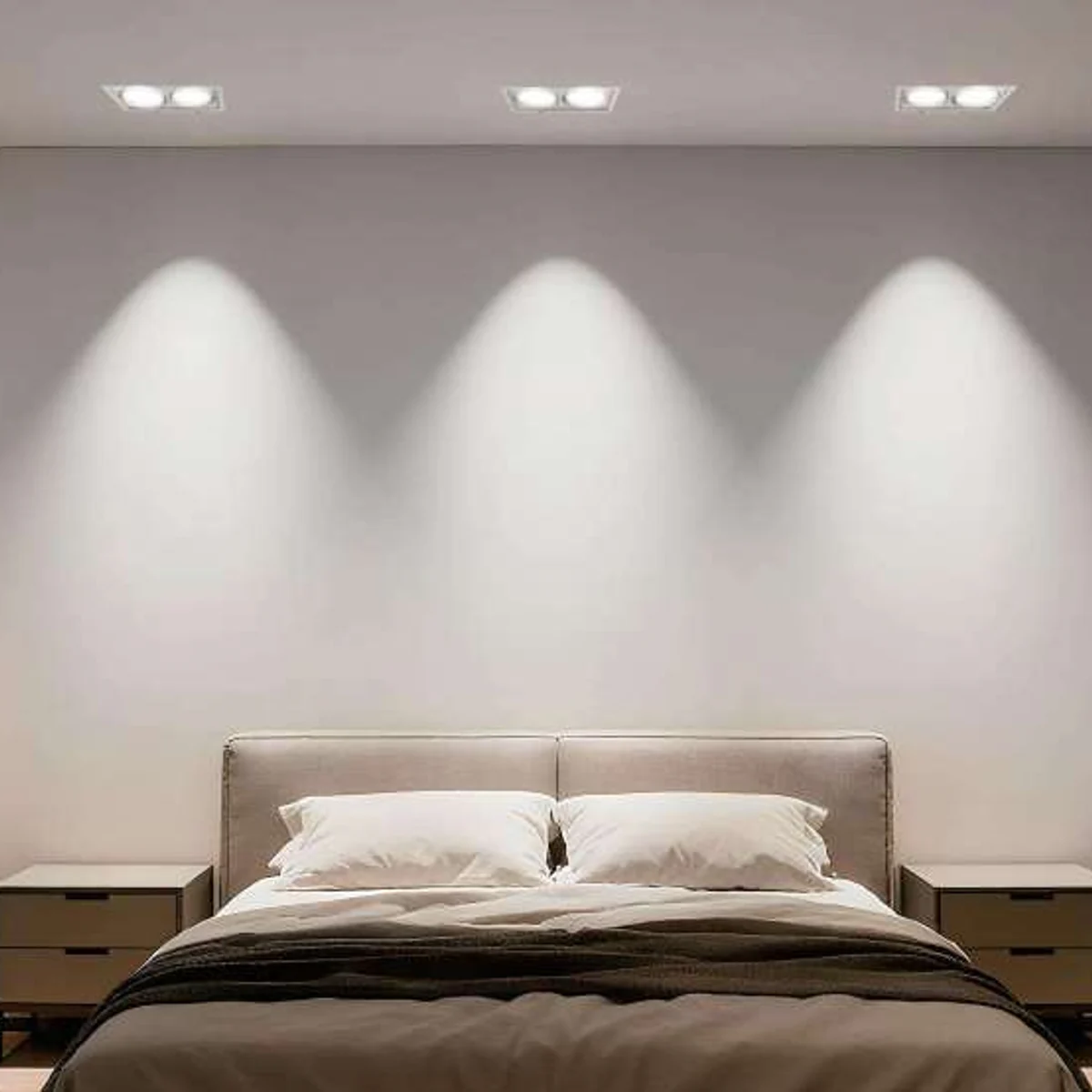 Multi-head GU10 recessed fixture frames installed flush in a bedroom ceiling