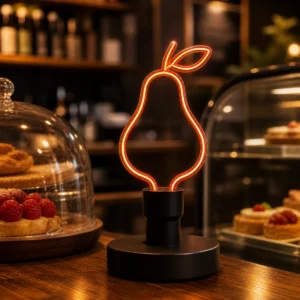 Pear-outline flexible-filament bulb in a compatible indoor cafe display base