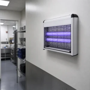 Two UV-A BL fluorescent tubes installed in enclosed wall-mounted insect-attraction equipment in a food-service utility area