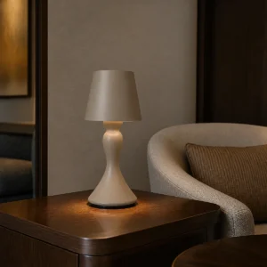 Sculpted cordless LED table lamp on an indoor side table