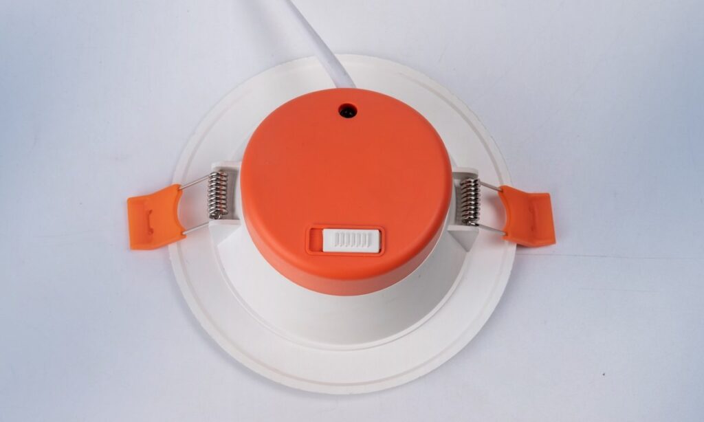 Recessed LED panel downlight photographed from the rear with spring clips