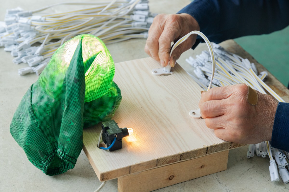 New Lights operator performing pre-packaging lighting checks