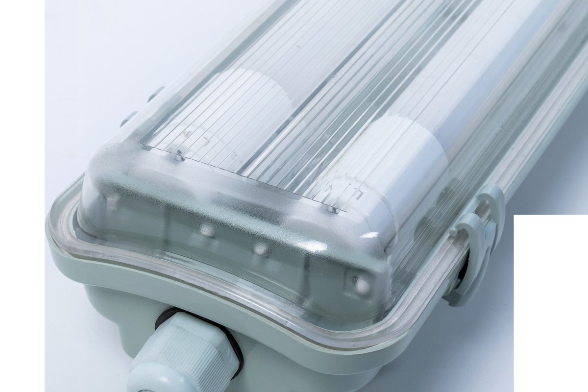Close view of a gasketed linear luminaire housing and cable entry