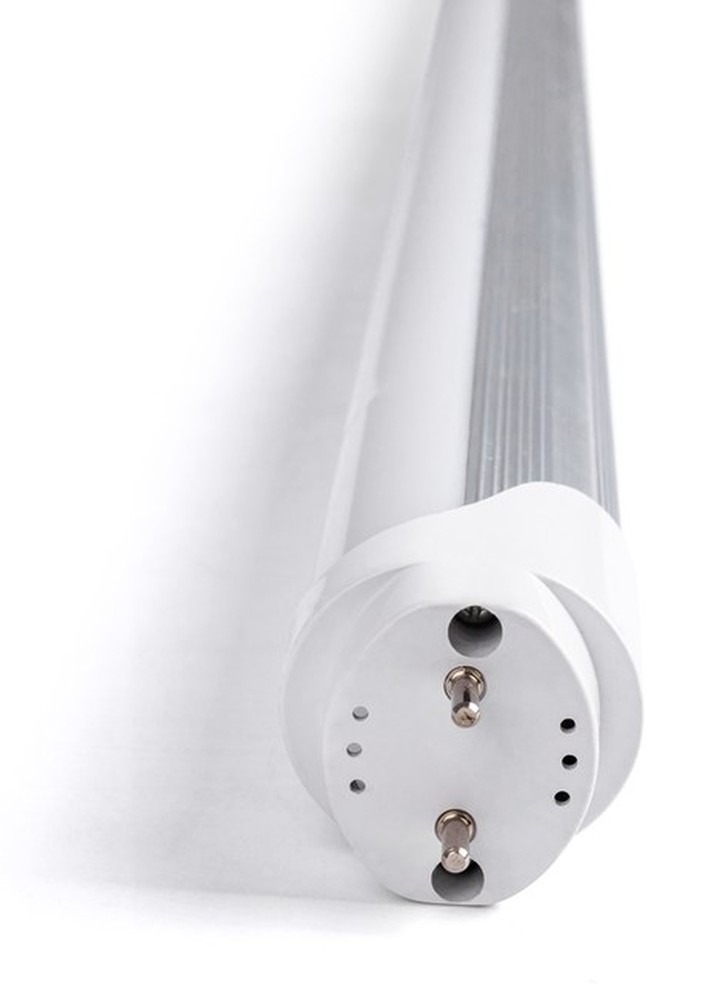 Close view of a New Lights T8 ALU PC LED tube showing the cap, pins, aluminium section and diffuser