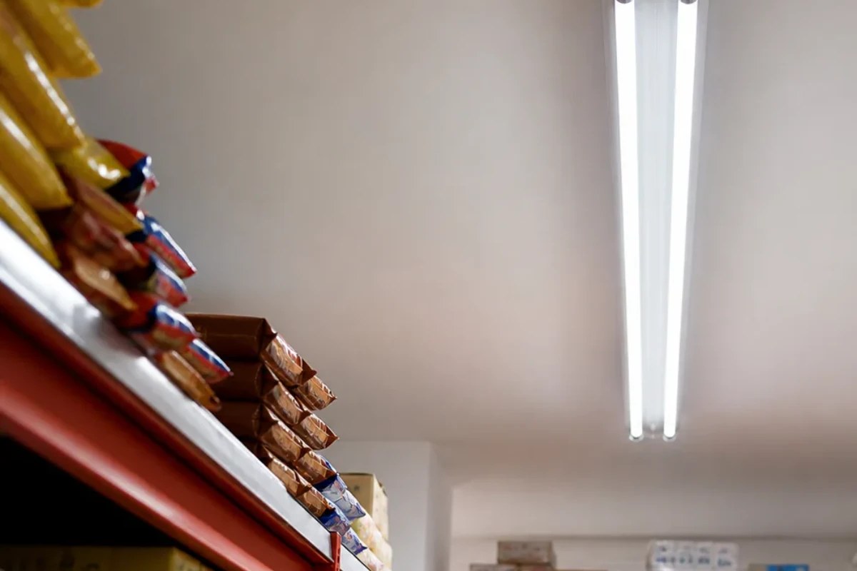 Two T8 LED glass tubes operating in a stockroom ceiling fixture